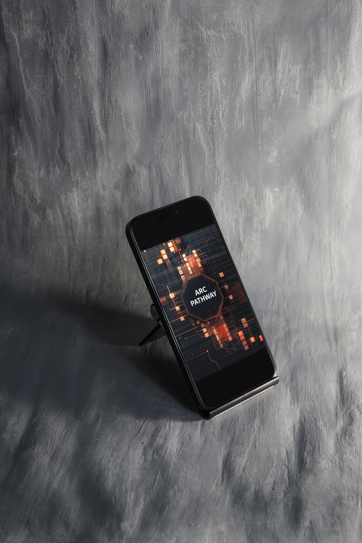 A black smartphone displayed upright on a small stand against a textured gray concrete wall. The phone screen shows a dark digital interface with orange glowing grid lines and a circular logo reading 'LATICE ARCHIVE'.