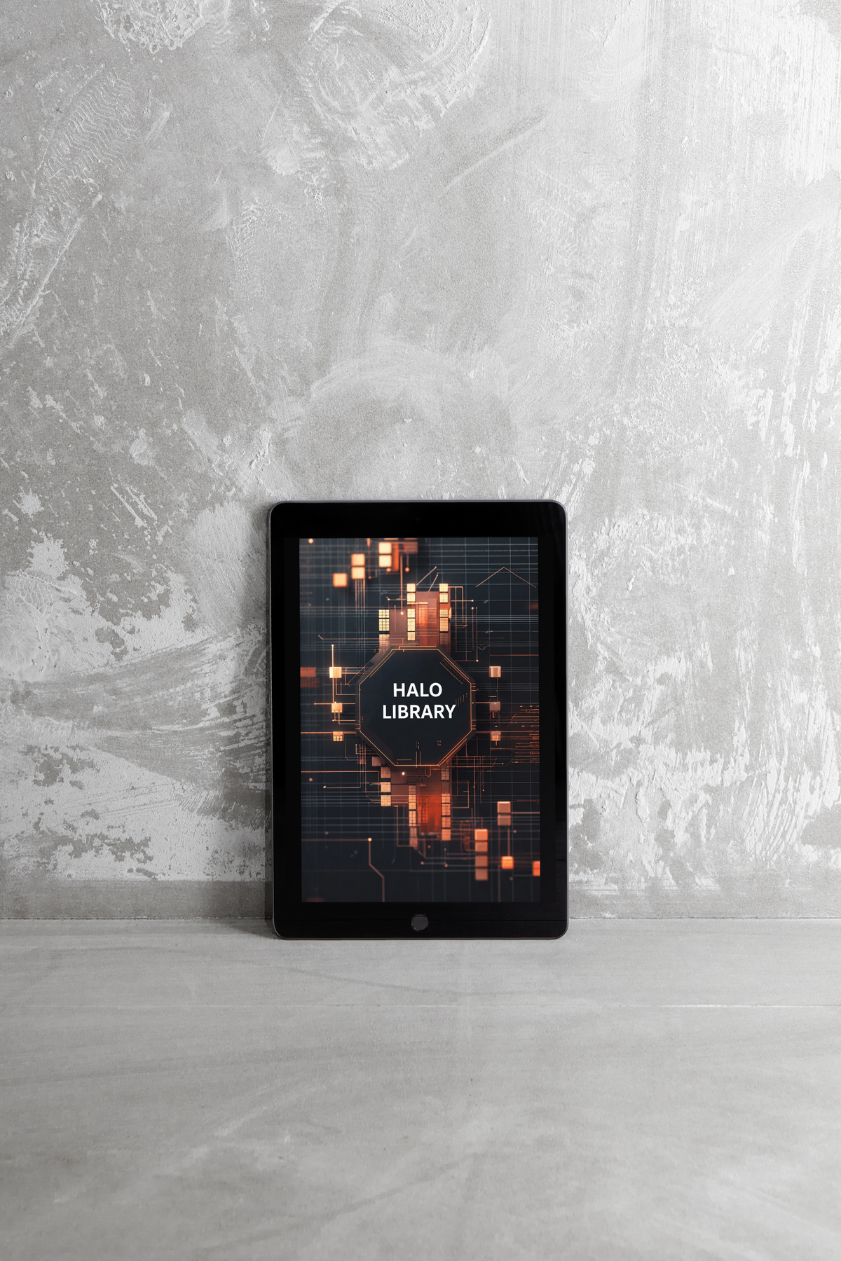 A black tablet device standing upright against a textured gray wall, displaying a digital cover for 'HALO LIBRARY' with glowing orange geometric graphics.