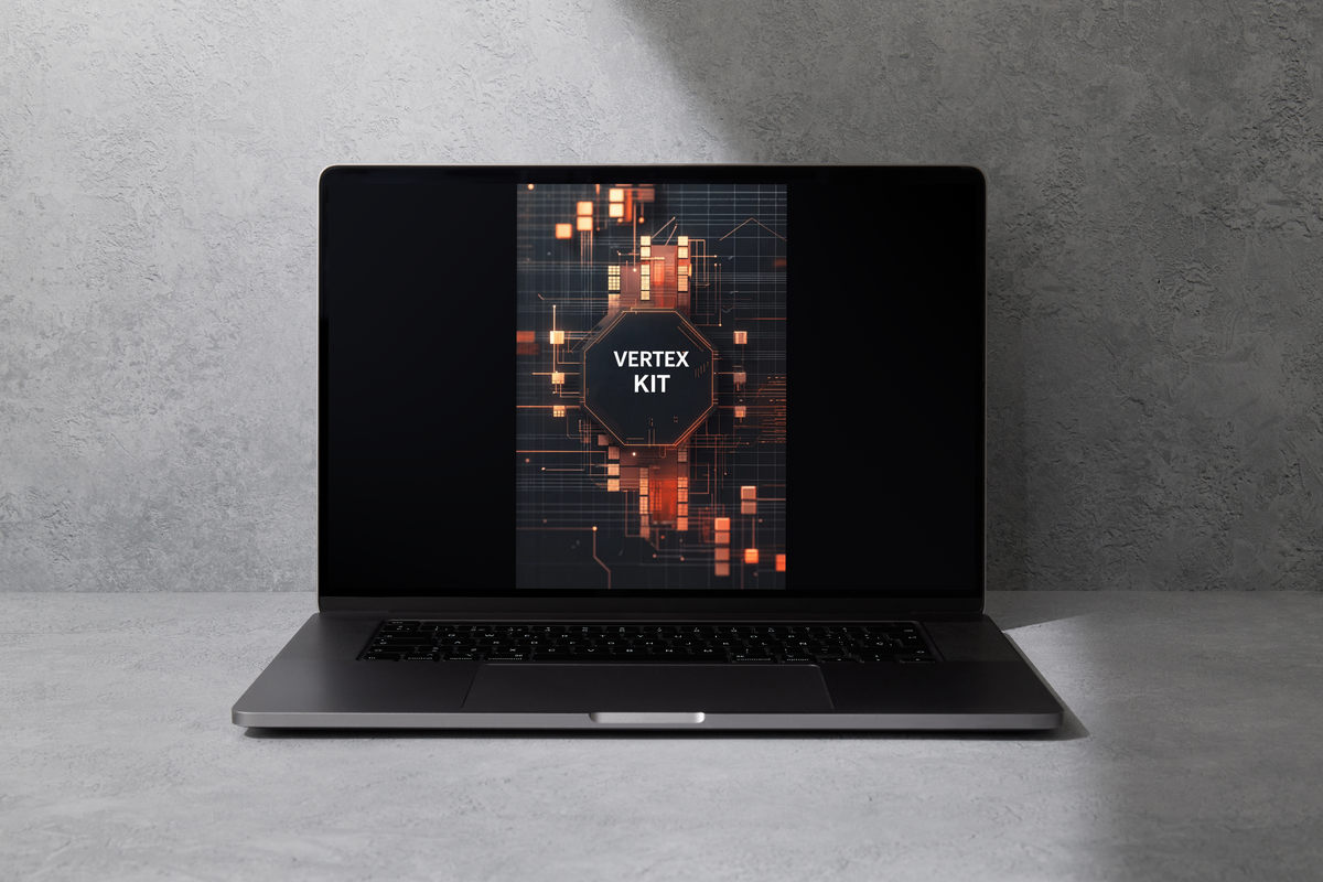 A dark gray laptop sits open on a light gray concrete surface against a textured gray wall. The laptop screen displays a digital graphic with the text 'FLOW MODULE' over a glowing orange and dark circuit-board design.